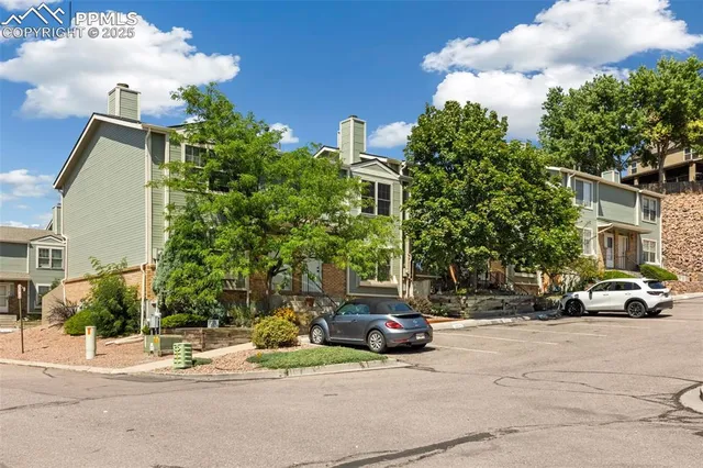 a view of street with parked cars