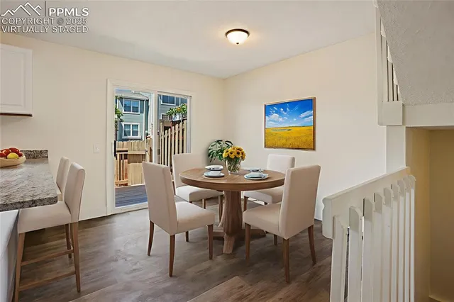 a view of a dining room with furniture wooden floor and a carpet