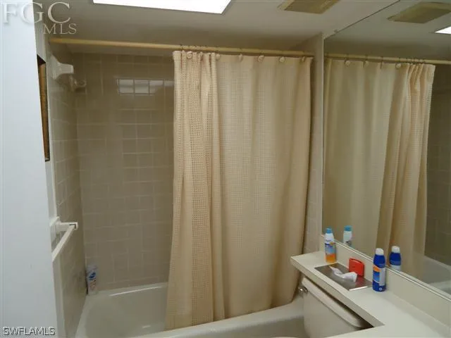 a bathroom with a sink and a shower