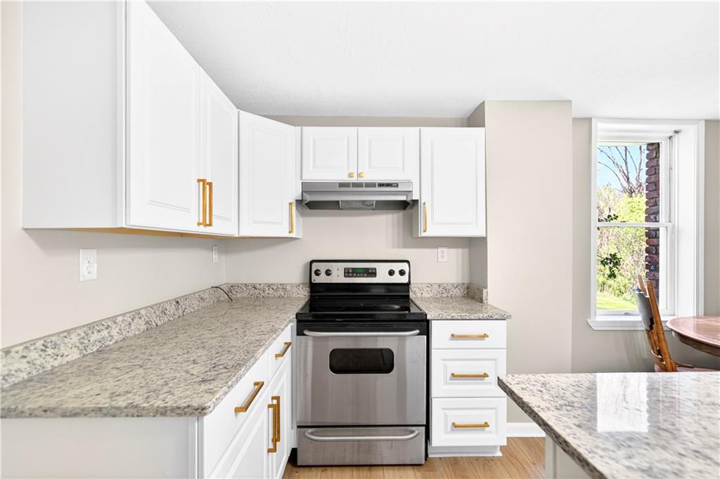 116 Dutchtown Road Herminie, PA 15637 - Photo 19 of 49 a kitchen with granite countertop white cabinets and white appliances