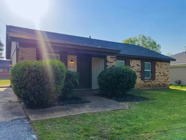 a view of a house with a garden