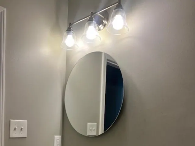 a view of a decorative light in a mirror