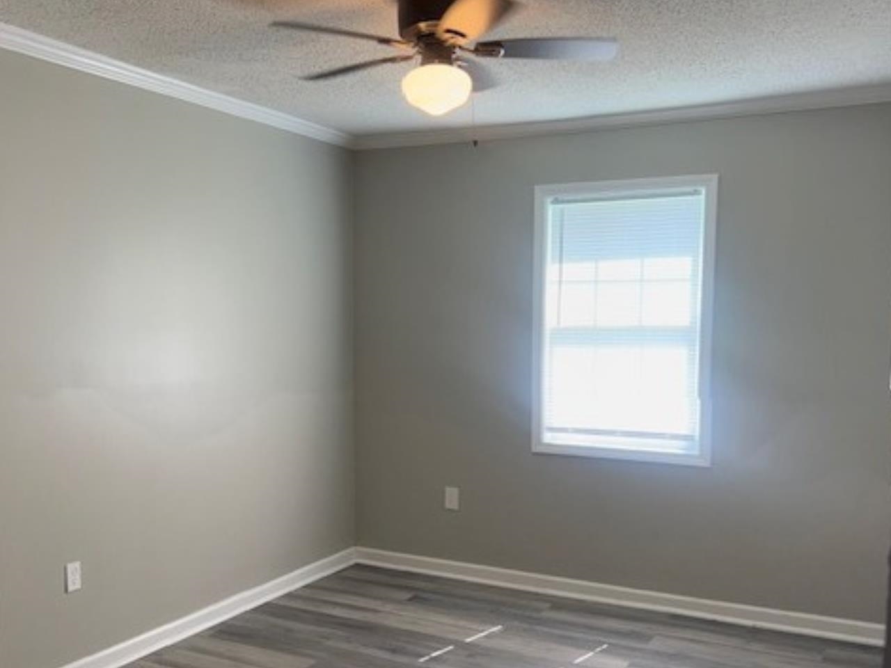 4710 Hillbrook Road Memphis, TN 38109 - Photo 8 of 11 an empty room with a window
