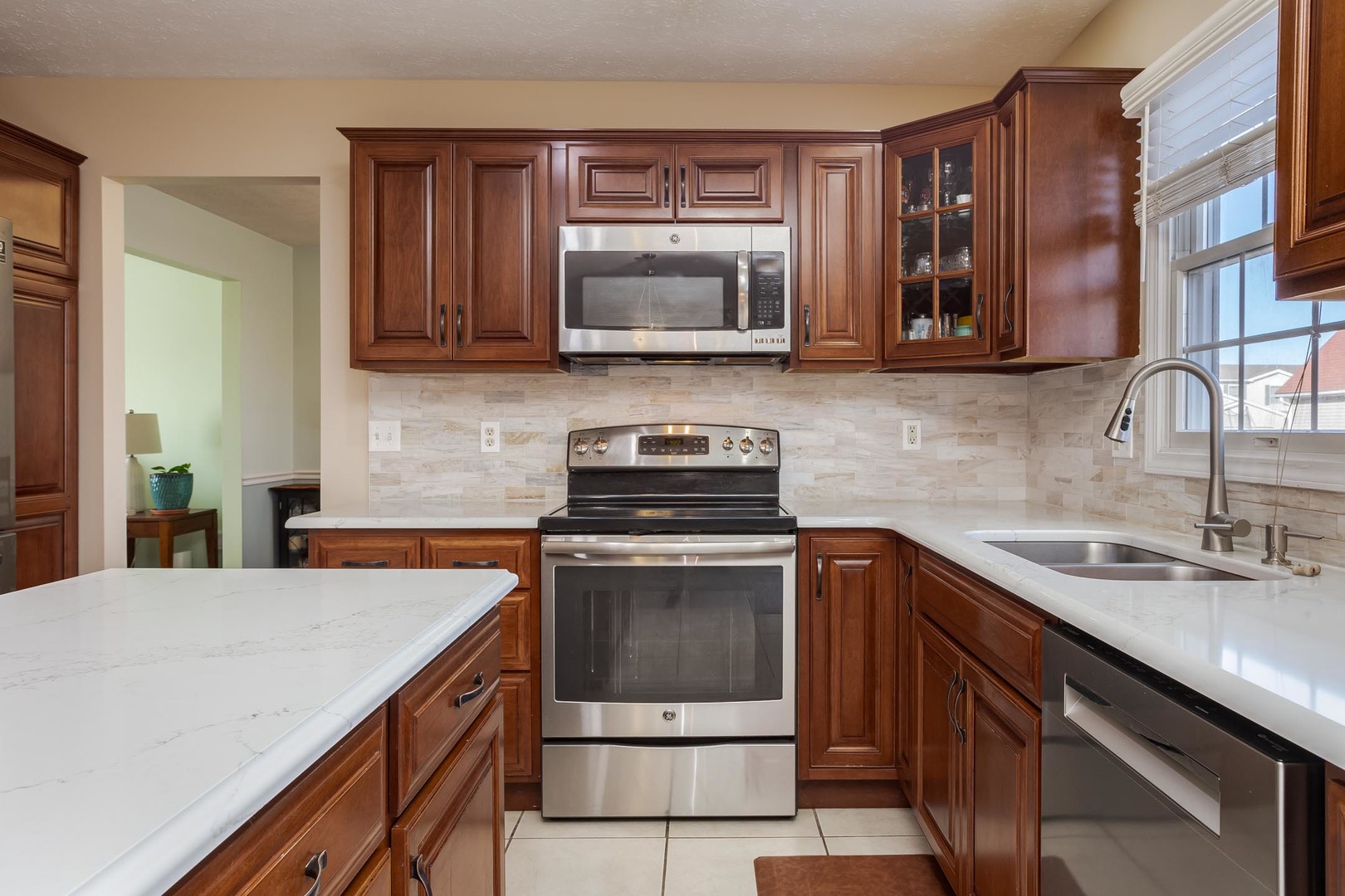 2884 Three Eagles Street Normal, IL 61761 - Photo 13 of 48 a kitchen with a sink and a stove top oven
