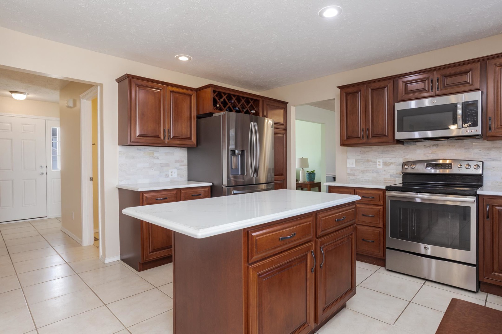 2884 Three Eagles Street Normal, IL 61761 - Photo 16 of 48 a kitchen that has a sink and a stove top oven