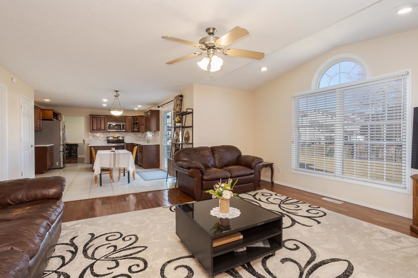 2884 Three Eagles Street Normal, IL 61761 - Photo 21 of 48 a living room with furniture and kitchen view