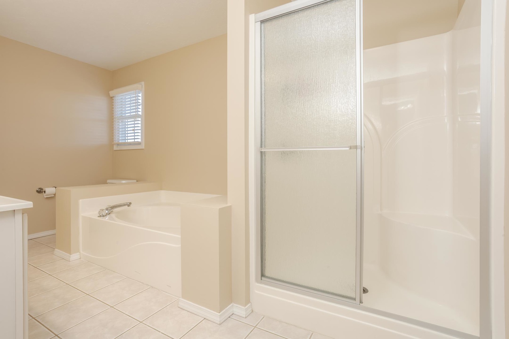 2884 Three Eagles Street Normal, IL 61761 - Photo 27 of 48 a bathroom with a bathtub and a shower