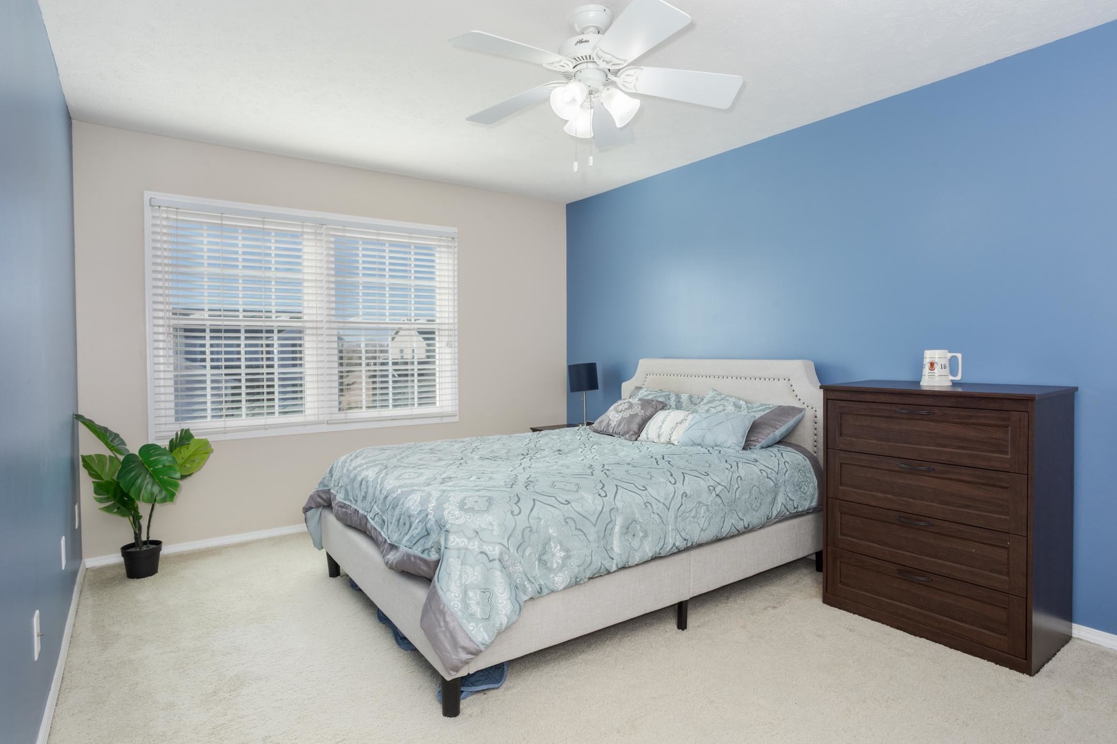 2884 Three Eagles Street Normal, IL 61761 - Photo 29 of 48 a bedroom with a bed and a potted plant