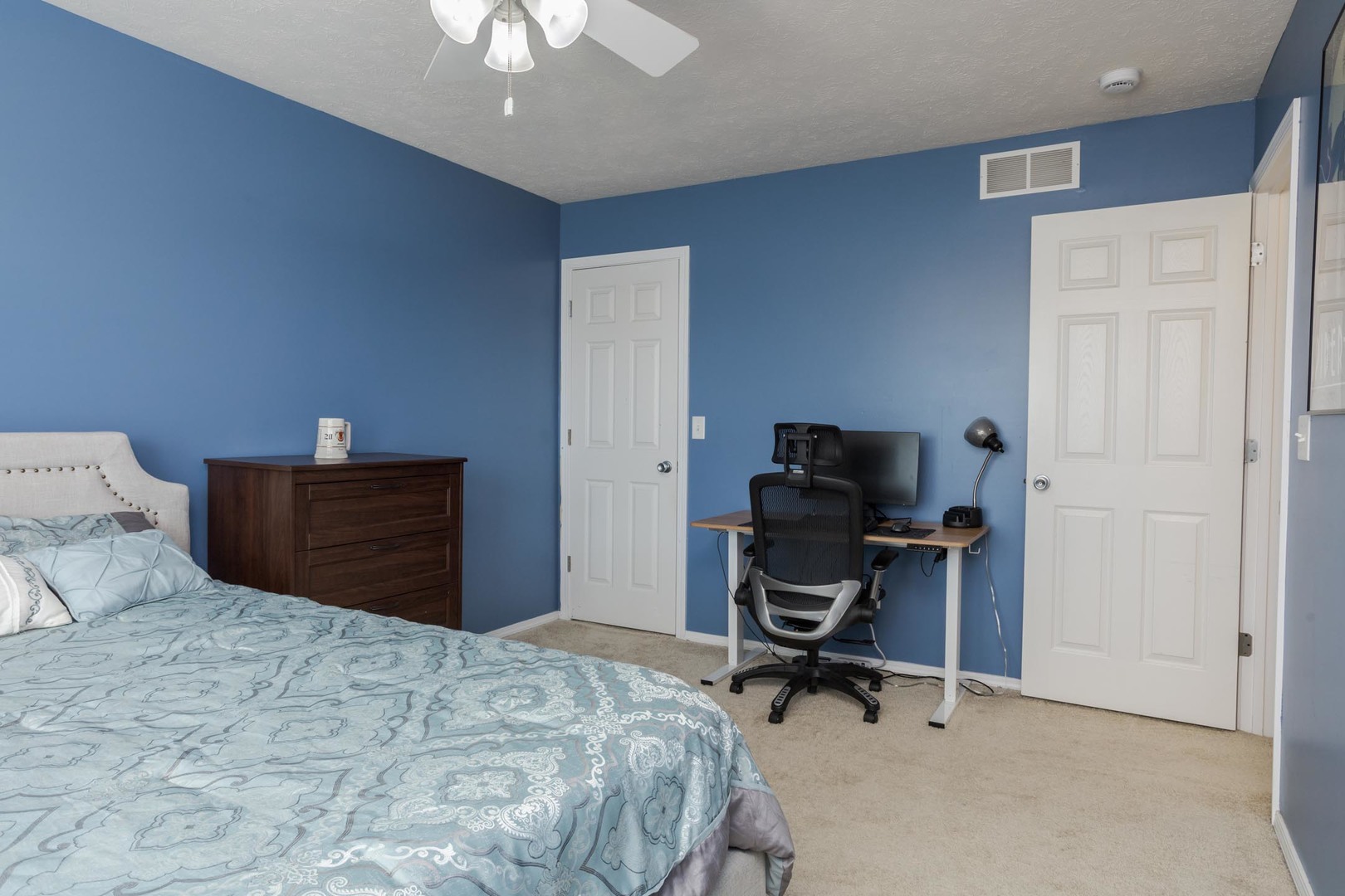 2884 Three Eagles Street Normal, IL 61761 - Photo 30 of 48 a bedroom with a bed and a chandelier