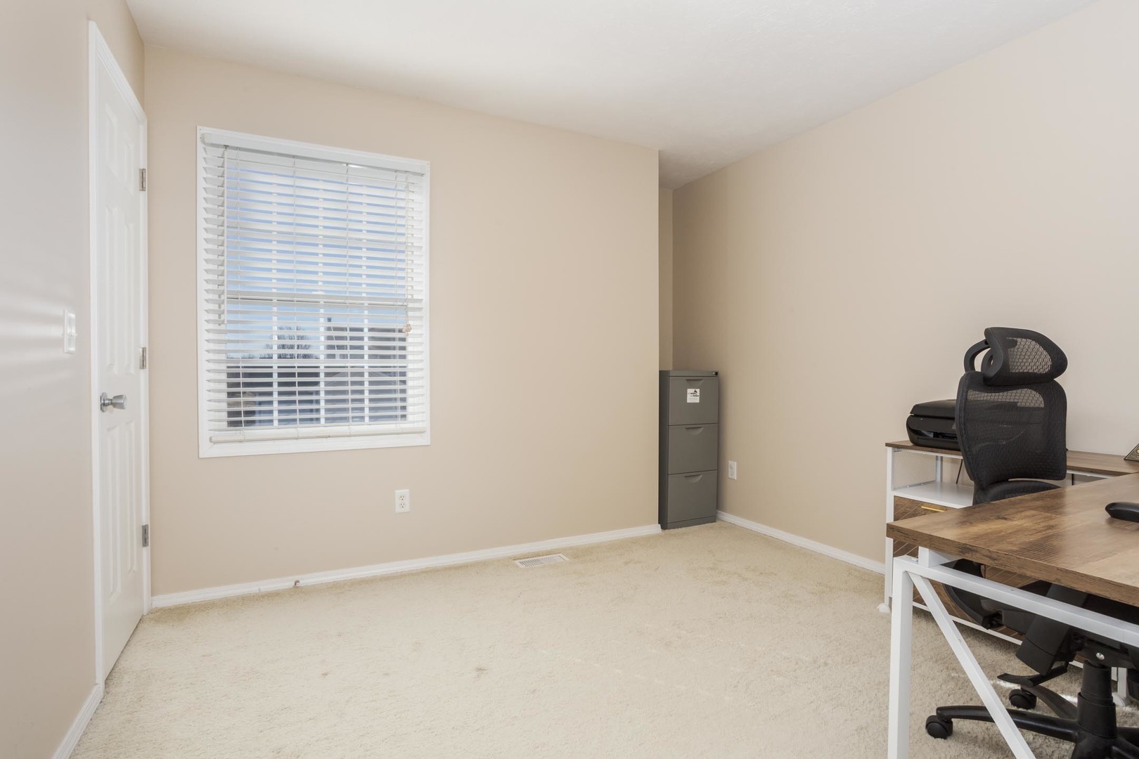 2884 Three Eagles Street Normal, IL 61761 - Photo 34 of 48 a view of a workspace with furniture and window
