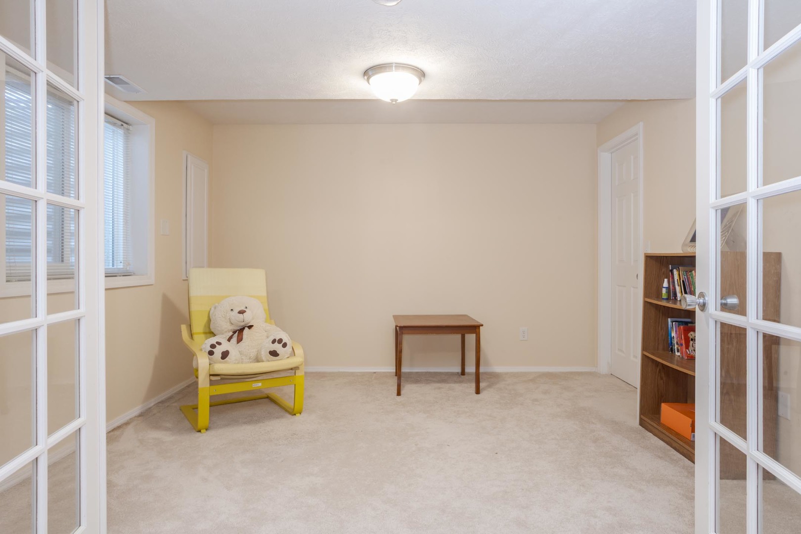 2884 Three Eagles Street Normal, IL 61761 - Photo 37 of 48 a living room with furniture and a book shelf