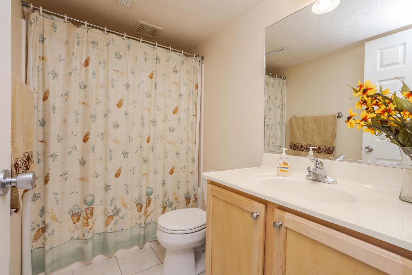 2884 Three Eagles Street Normal, IL 61761 - Photo 39 of 48 a bathroom with a sink a toilet and shower curtain