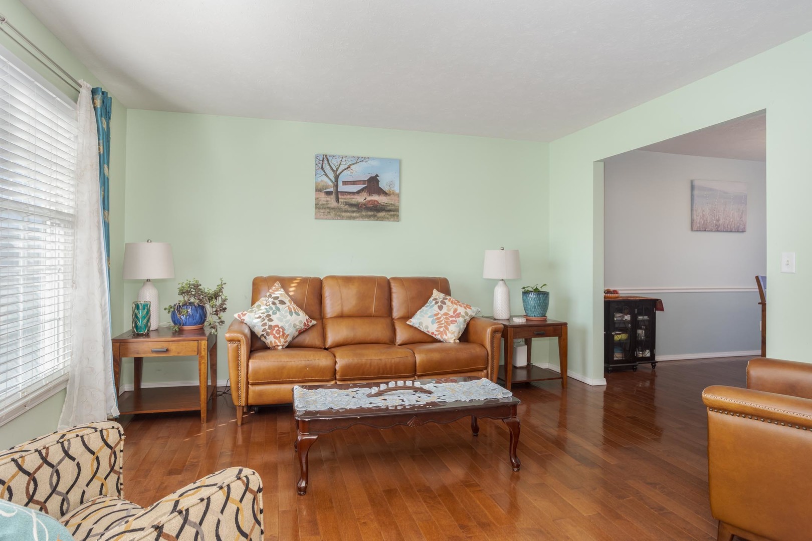 2884 Three Eagles Street Normal, IL 61761 - Photo 7 of 48 a living room with furniture and a wooden floor
