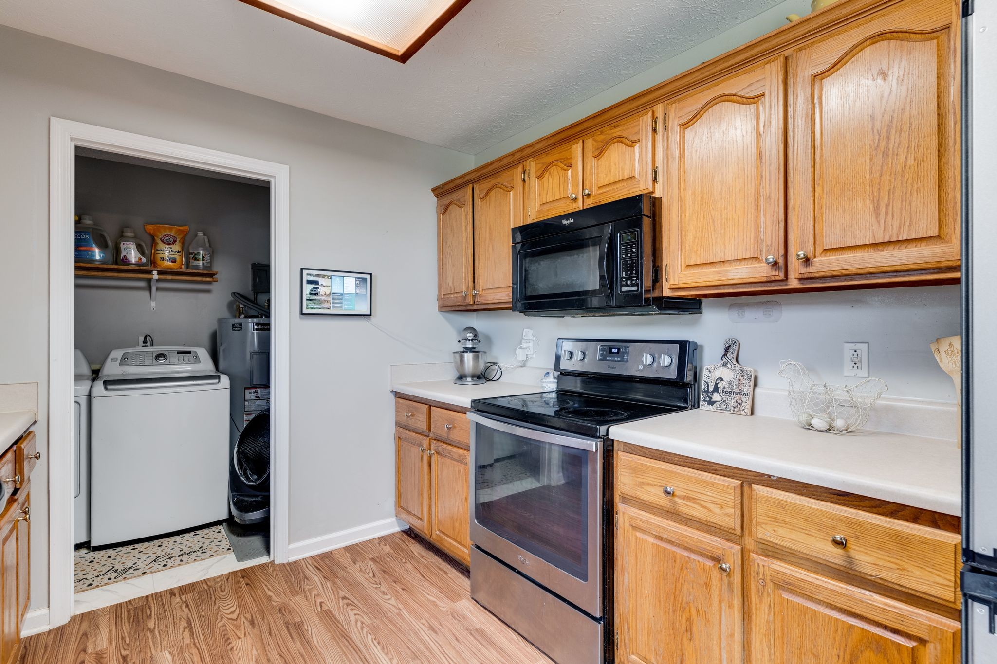 630 Portland Boulevard Portland, TN 37148 - Photo 12 of 29 a kitchen with stainless steel appliances a stove microwave and a sink