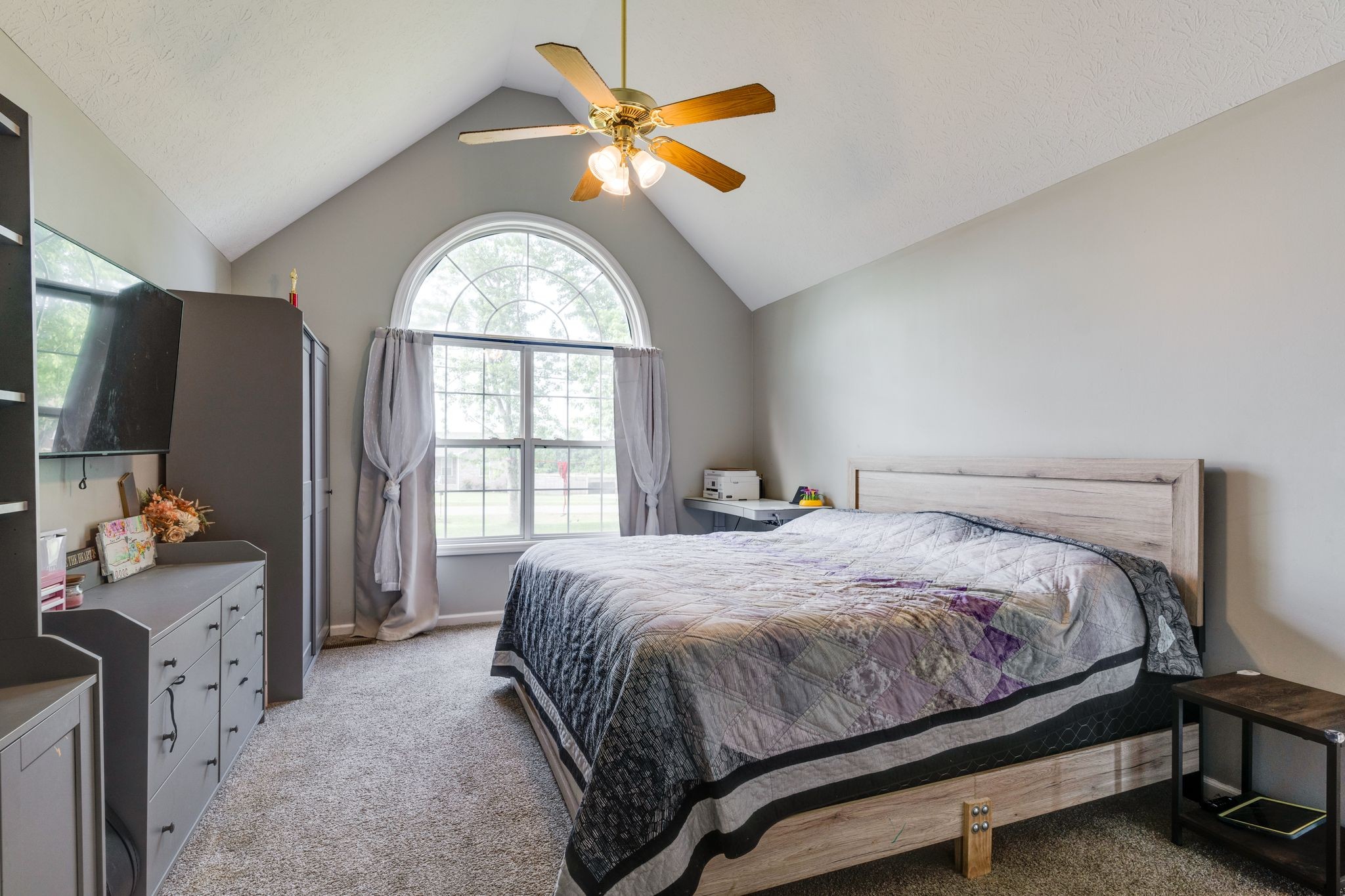 630 Portland Boulevard Portland, TN 37148 - Photo 15 of 29 a bedroom with a bed and a chandelier