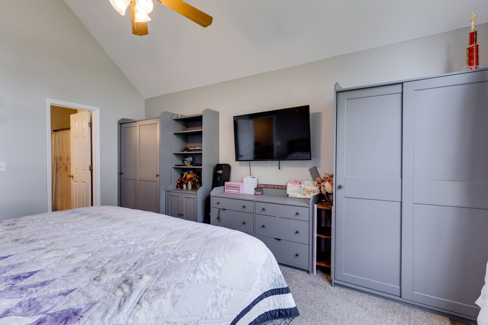 630 Portland Boulevard Portland, TN 37148 - Photo 16 of 29 a bedroom with a bed and a flat screen tv