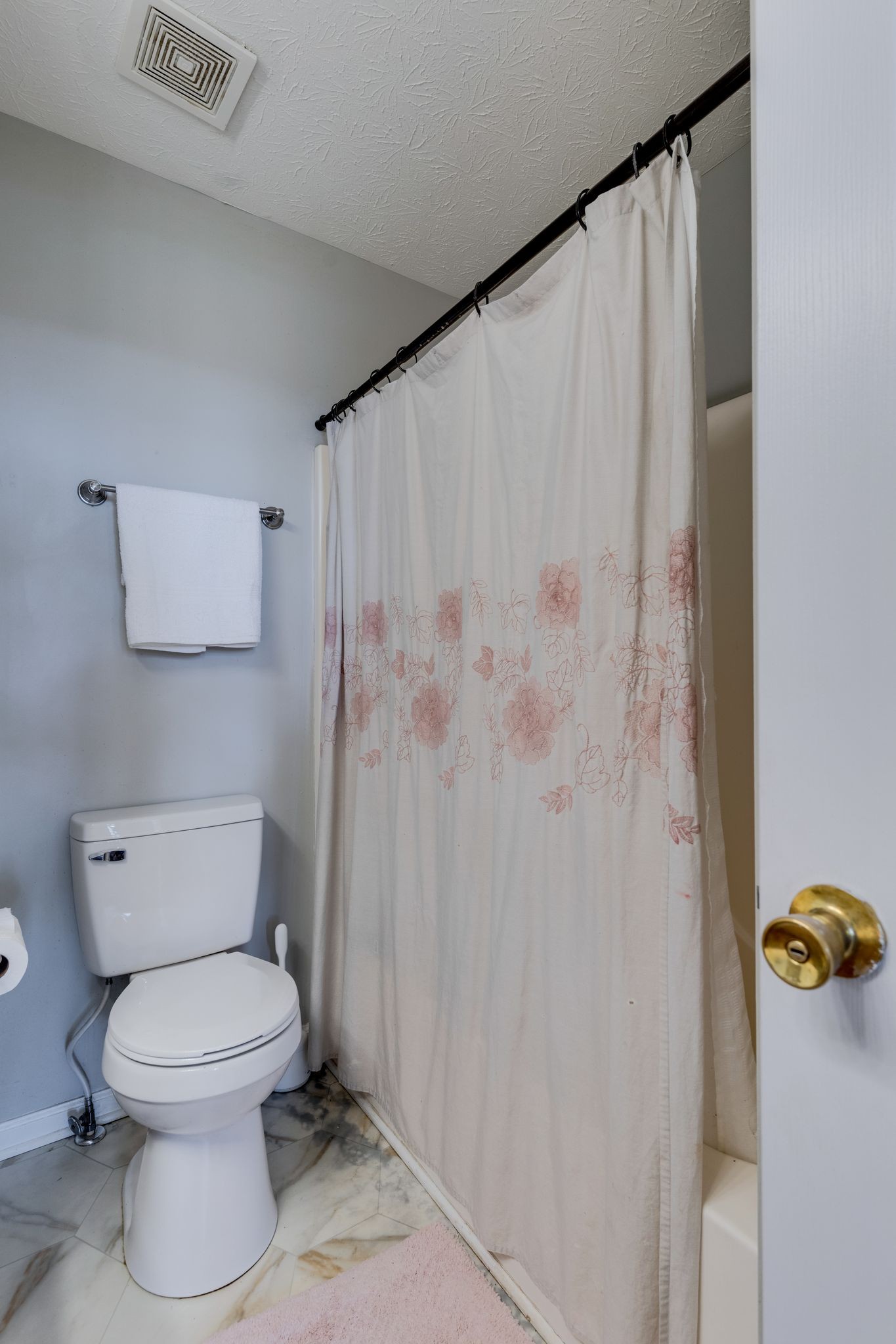 630 Portland Boulevard Portland, TN 37148 - Photo 18 of 29 a white toilet sitting next to a shower curtain