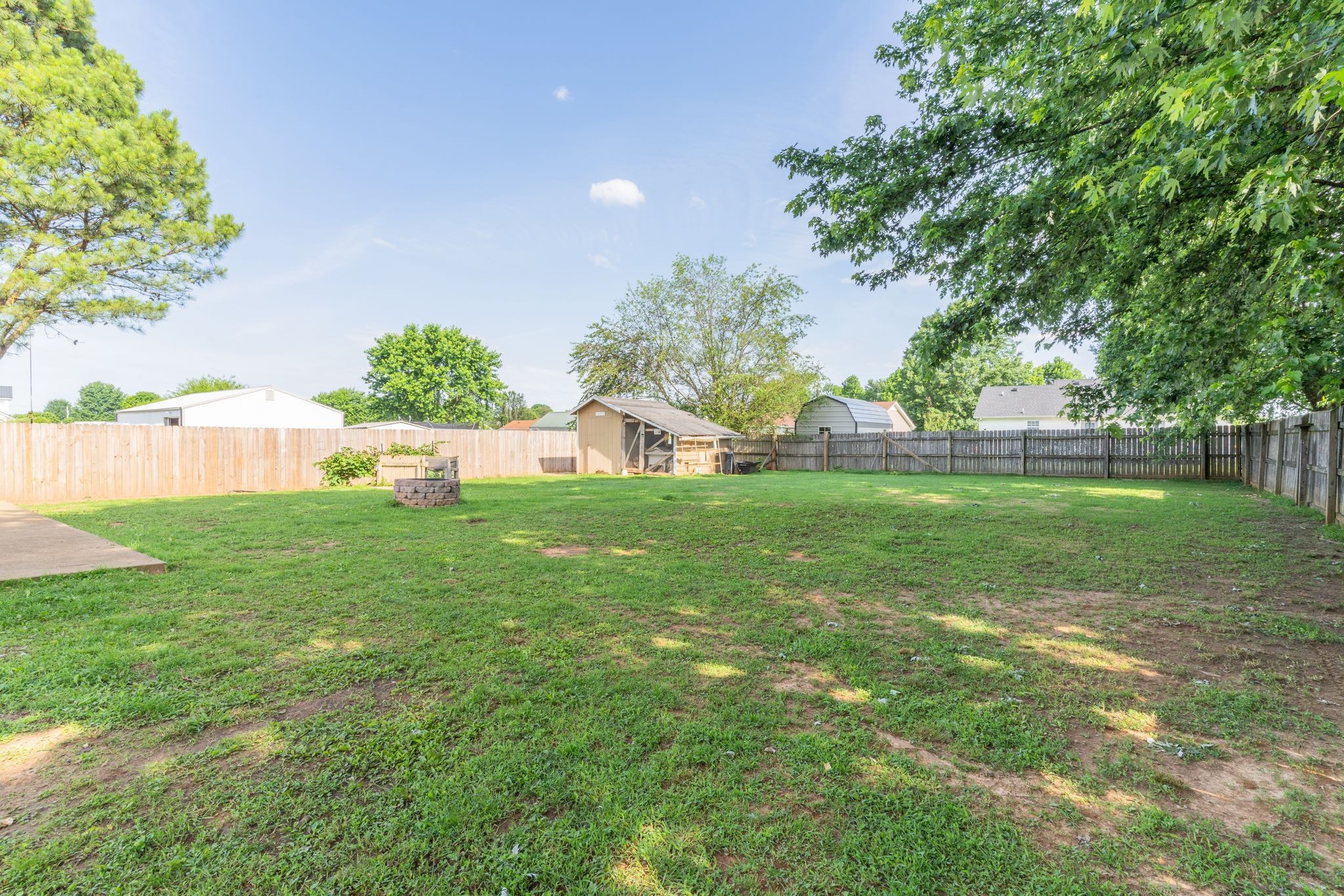 630 Portland Boulevard Portland, TN 37148 - Photo 26 of 29 a view of backyard with garden and trees