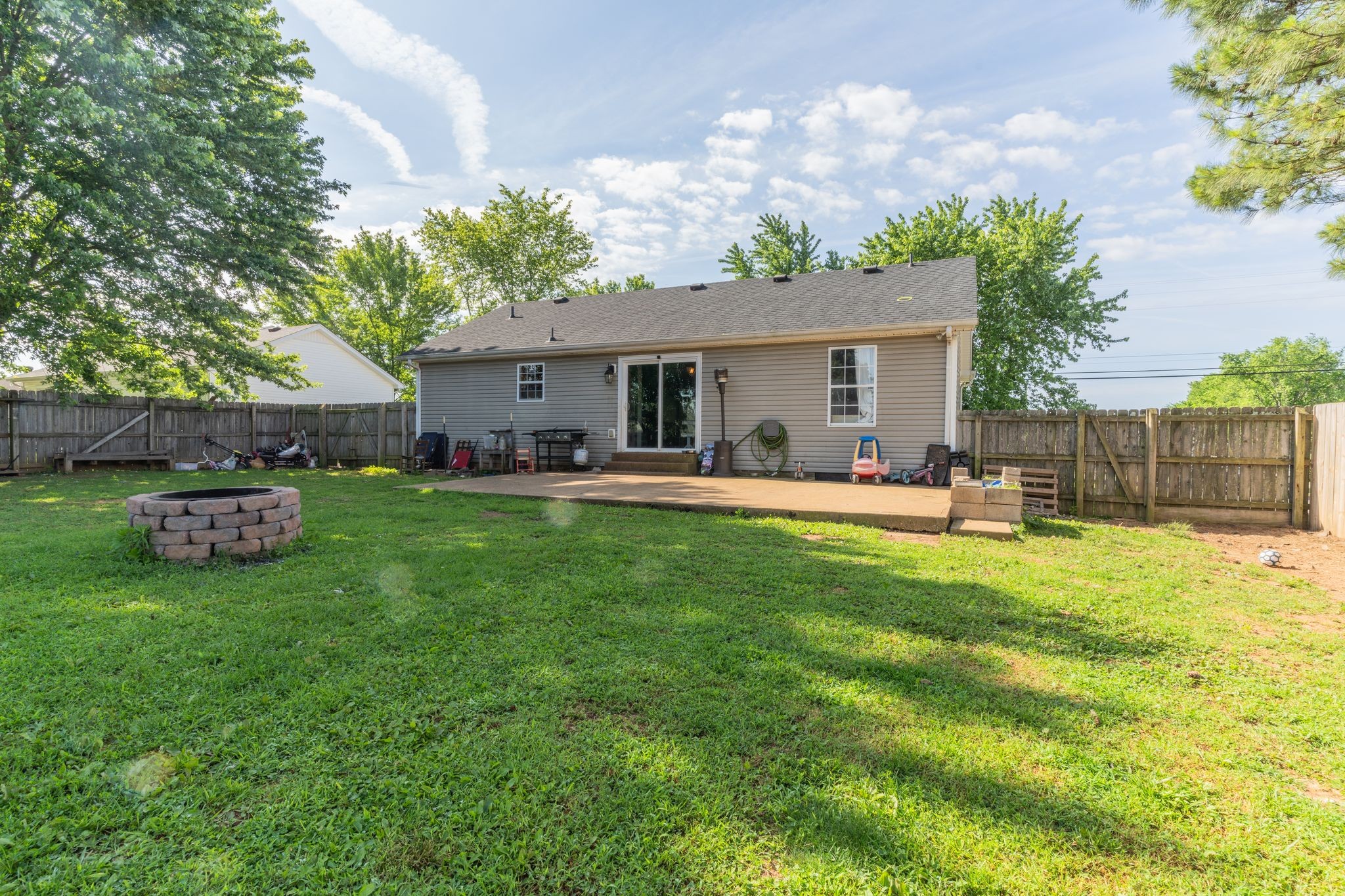 630 Portland Boulevard Portland, TN 37148 - Photo 29 of 29 a view of a house with a backyard and a patio