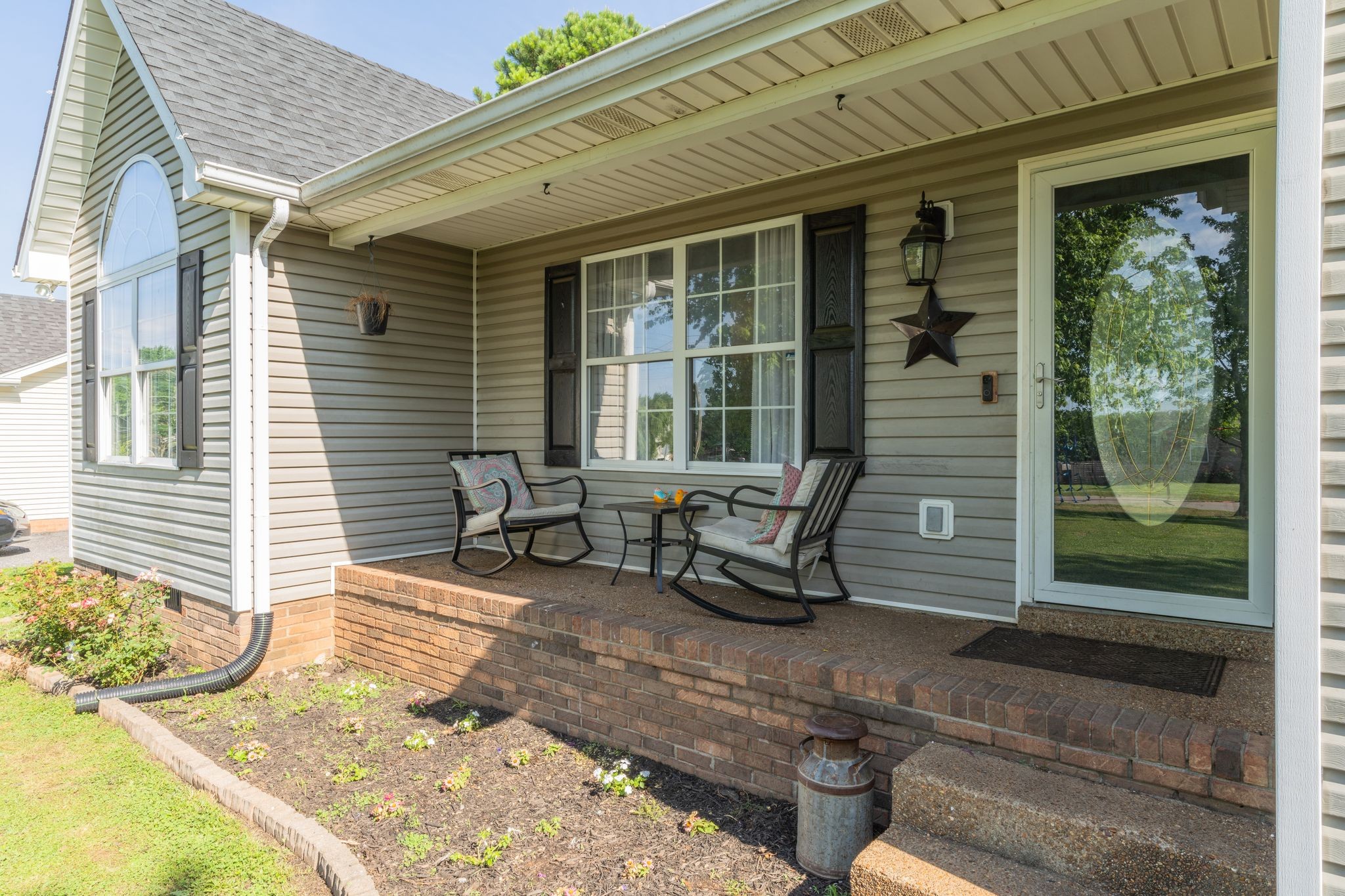 630 Portland Boulevard Portland, TN 37148 - Photo 5 of 29 a view of a two chair in the patio with wooden fence