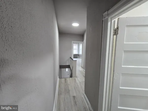 an empty room with wooden floor