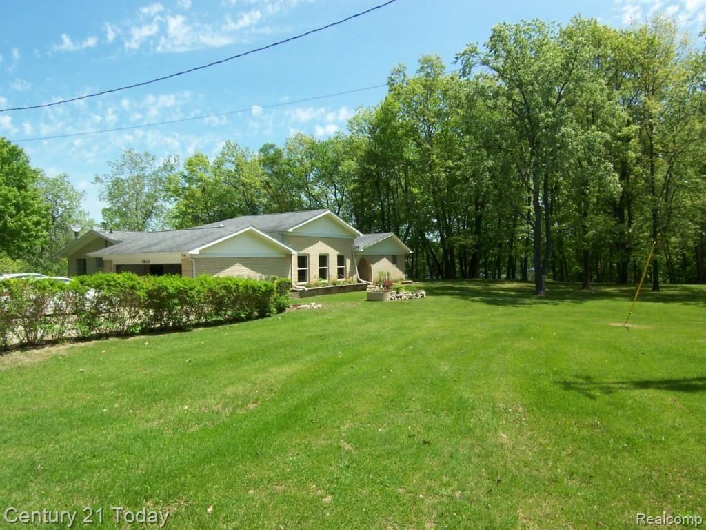 5800 Havens Road Leonard, MI 48367 - Photo 1 of 26 Front yard coming in