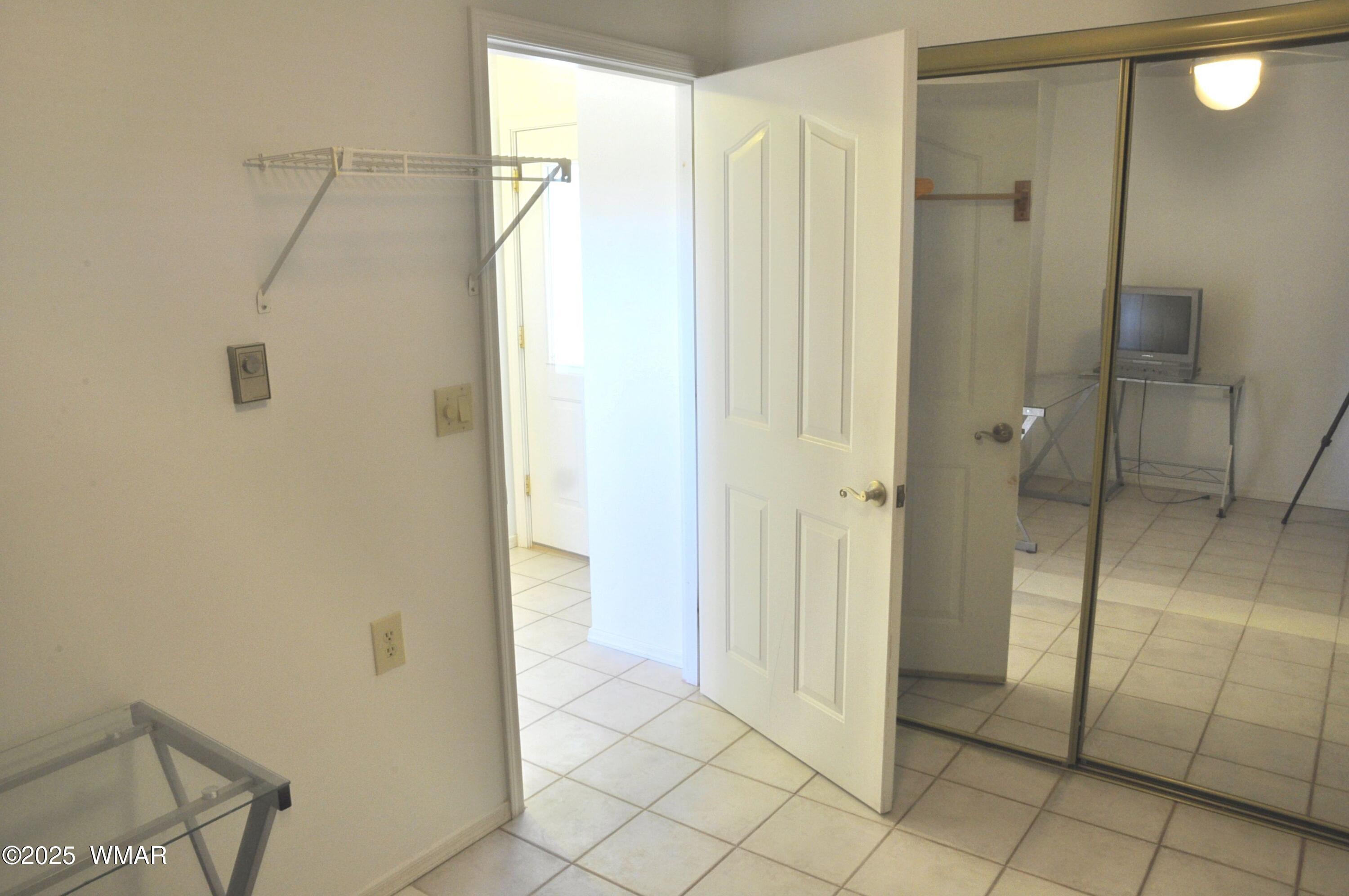 5196 White Antelope Road Snowflake, AZ 85937 - Photo 12 of 58 a bathroom with a shower and a glass door