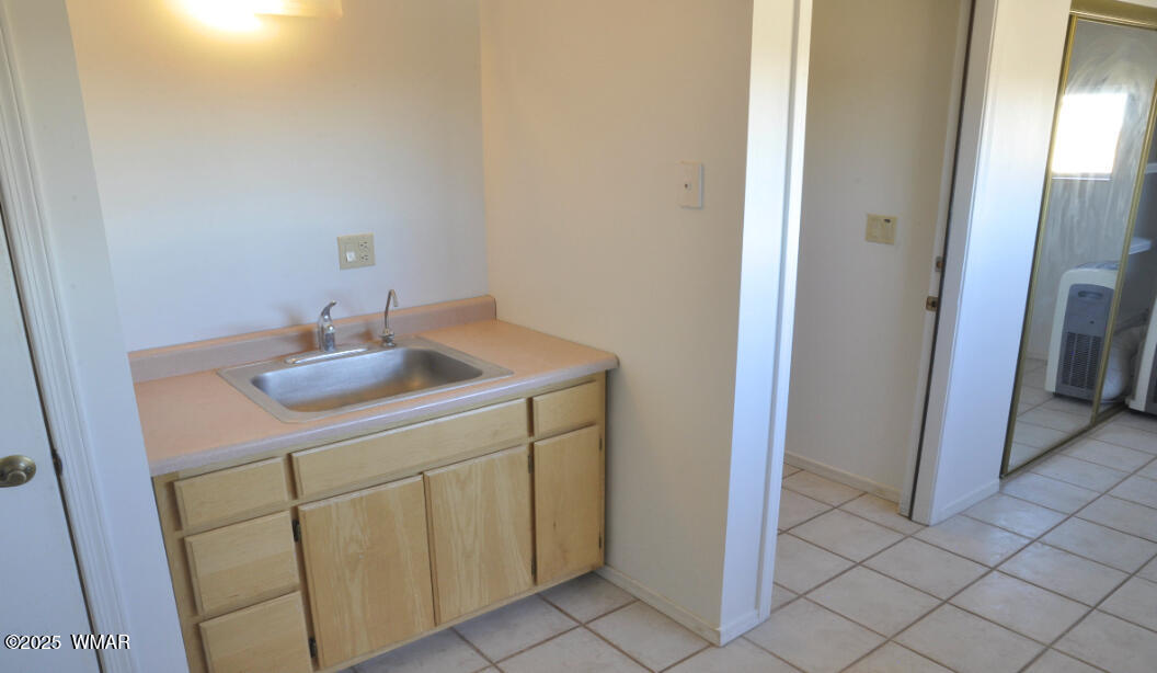 5196 White Antelope Road Snowflake, AZ 85937 - Photo 17 of 58 a bathroom with a sink and a mirror
