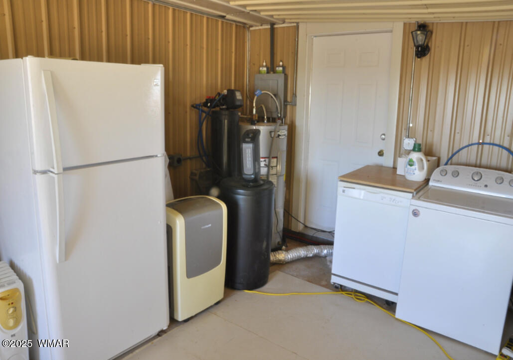 5196 White Antelope Road Snowflake, AZ 85937 - Photo 27 of 58 a white refrigerator freezer sitting in a kitchen