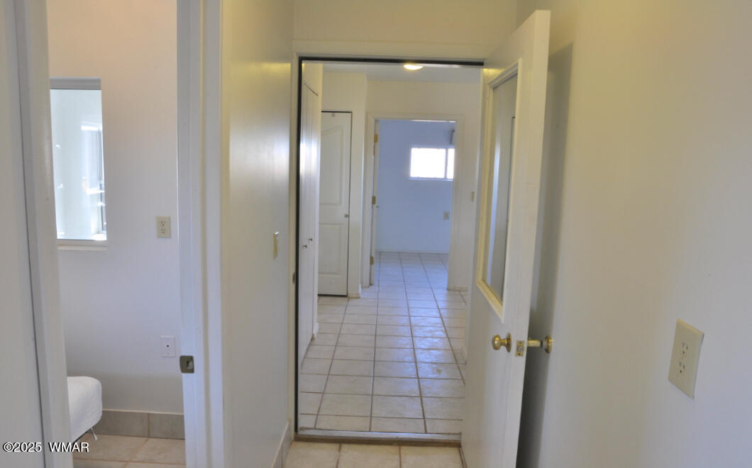5196 White Antelope Road Snowflake, AZ 85937 - Photo 9 of 58 a bathroom with a glass shower door