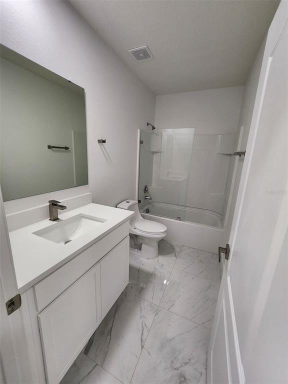 2359 Tay Wes Drive St. Cloud, FL 34771 - Photo 11 of 15 a bathroom with a sink a toilet and shower