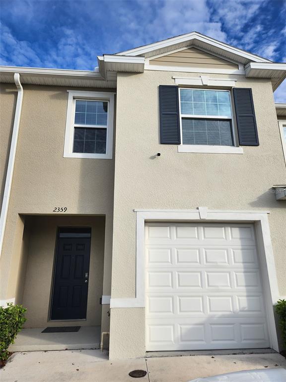 2359 Tay Wes Drive St. Cloud, FL 34771 - Photo 2 of 15 a front view of a house