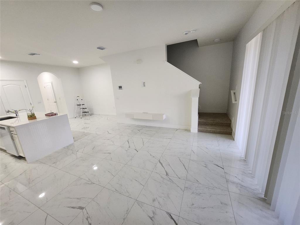 2359 Tay Wes Drive St. Cloud, FL 34771 - Photo 5 of 15 a view of a big room with kitchen and natural light