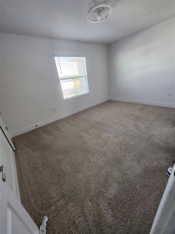 2359 Tay Wes Drive St. Cloud, FL 34771 - Photo 8 of 15 an empty room with a window