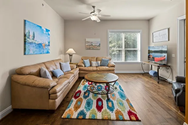 a living room with furniture and a table