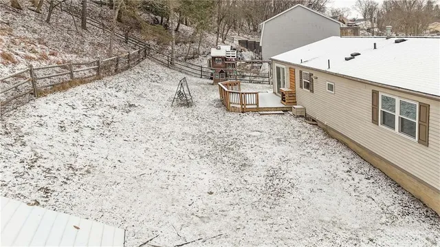 a view of a backyard with large trees
