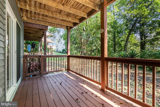 a view of balcony with wooden floor