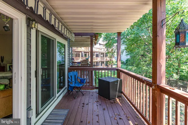 a view of a balcony with wooden floor
