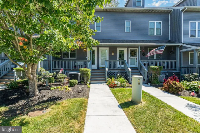a view of a swimming pool with an ocean and beach
