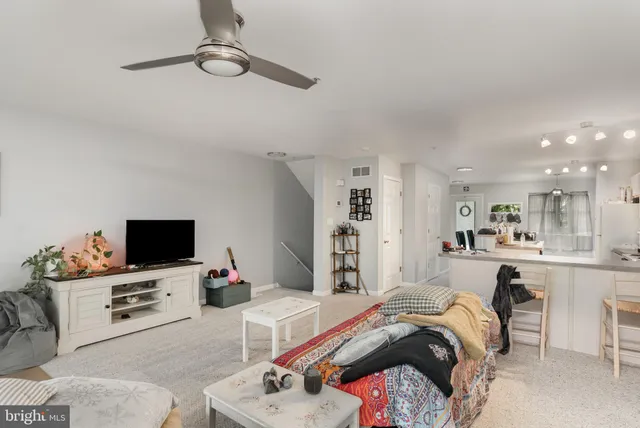 a bed room with a bed a television and a couch