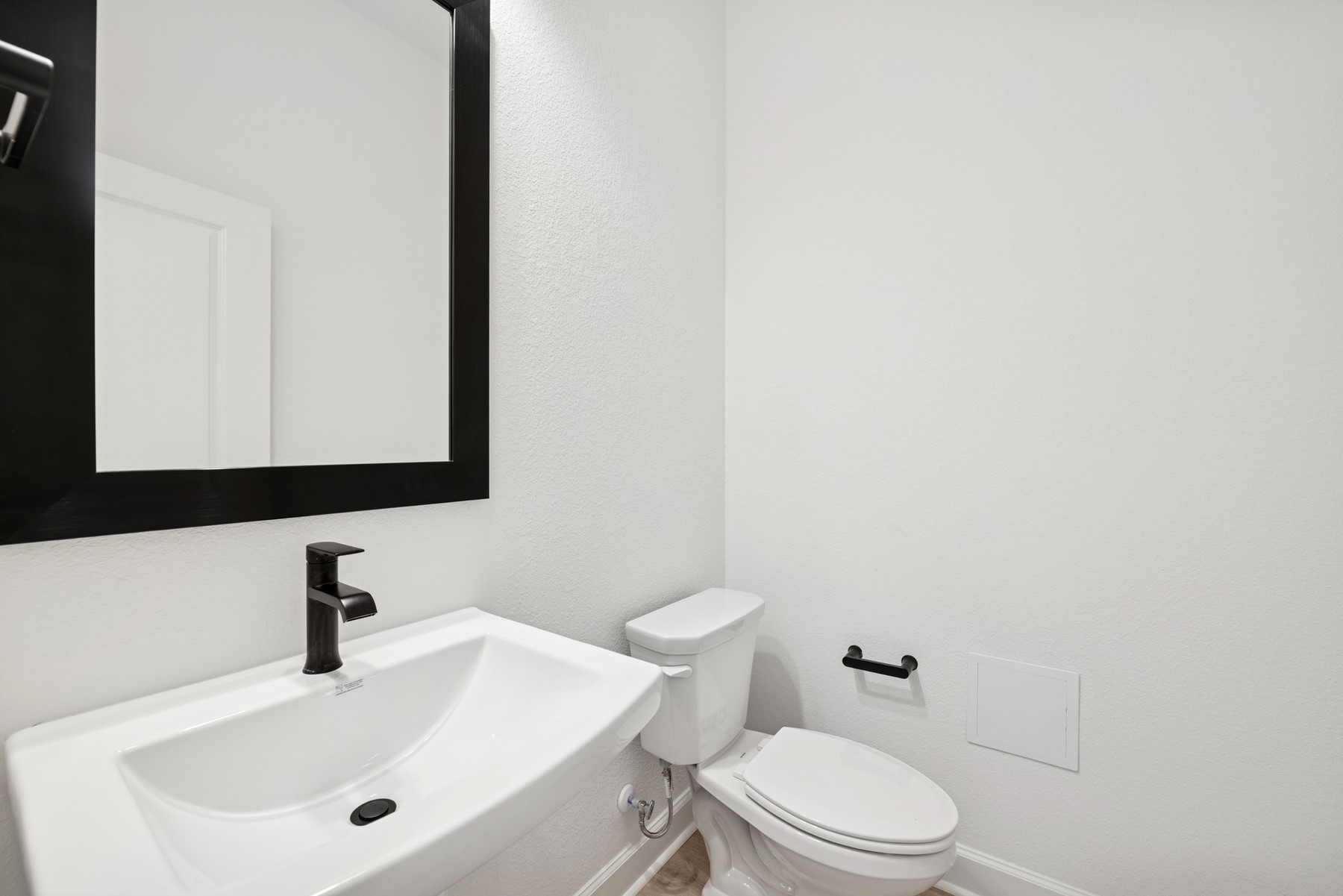 5526 Orangery Lane Manvel, TX 77578 - Photo 15 of 47 a bathroom with a sink a mirror and a toilet