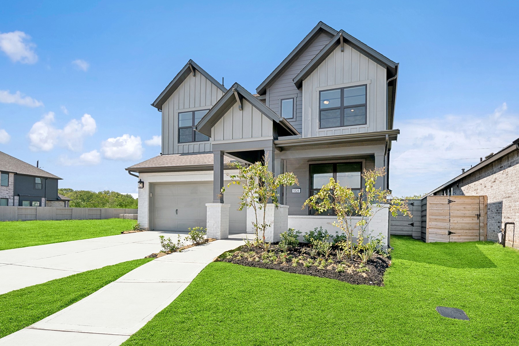 5526 Orangery Lane Manvel, TX 77578 - Photo 2 of 47 a front view of a house with a yard and garage
