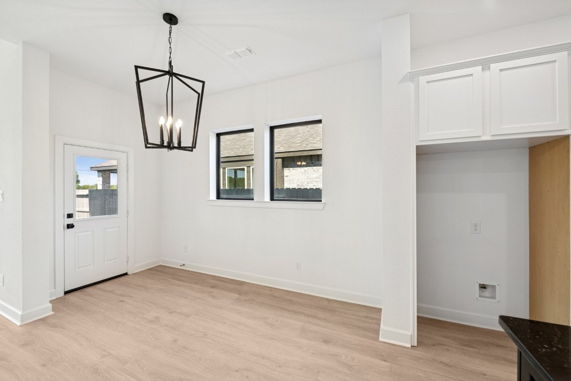 5526 Orangery Lane Manvel, TX 77578 - Photo 20 of 47 a view of empty room with wooden floor