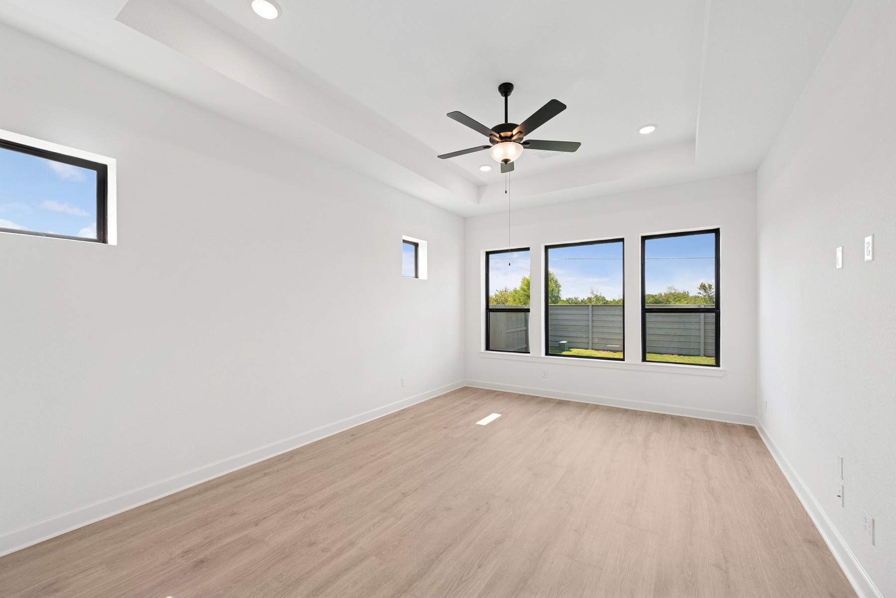 5526 Orangery Lane Manvel, TX 77578 - Photo 25 of 47 a view of an empty room with a window and wooden floor