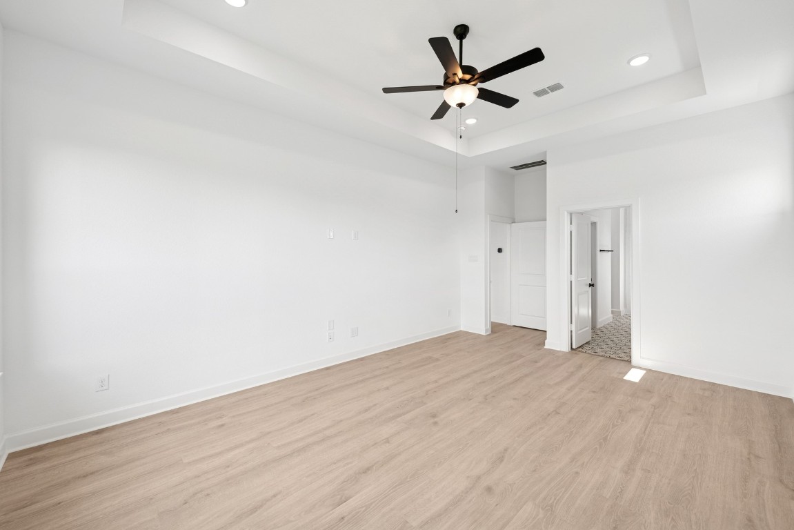5526 Orangery Lane Manvel, TX 77578 - Photo 27 of 47 an empty room with wooden floor and ceiling fan