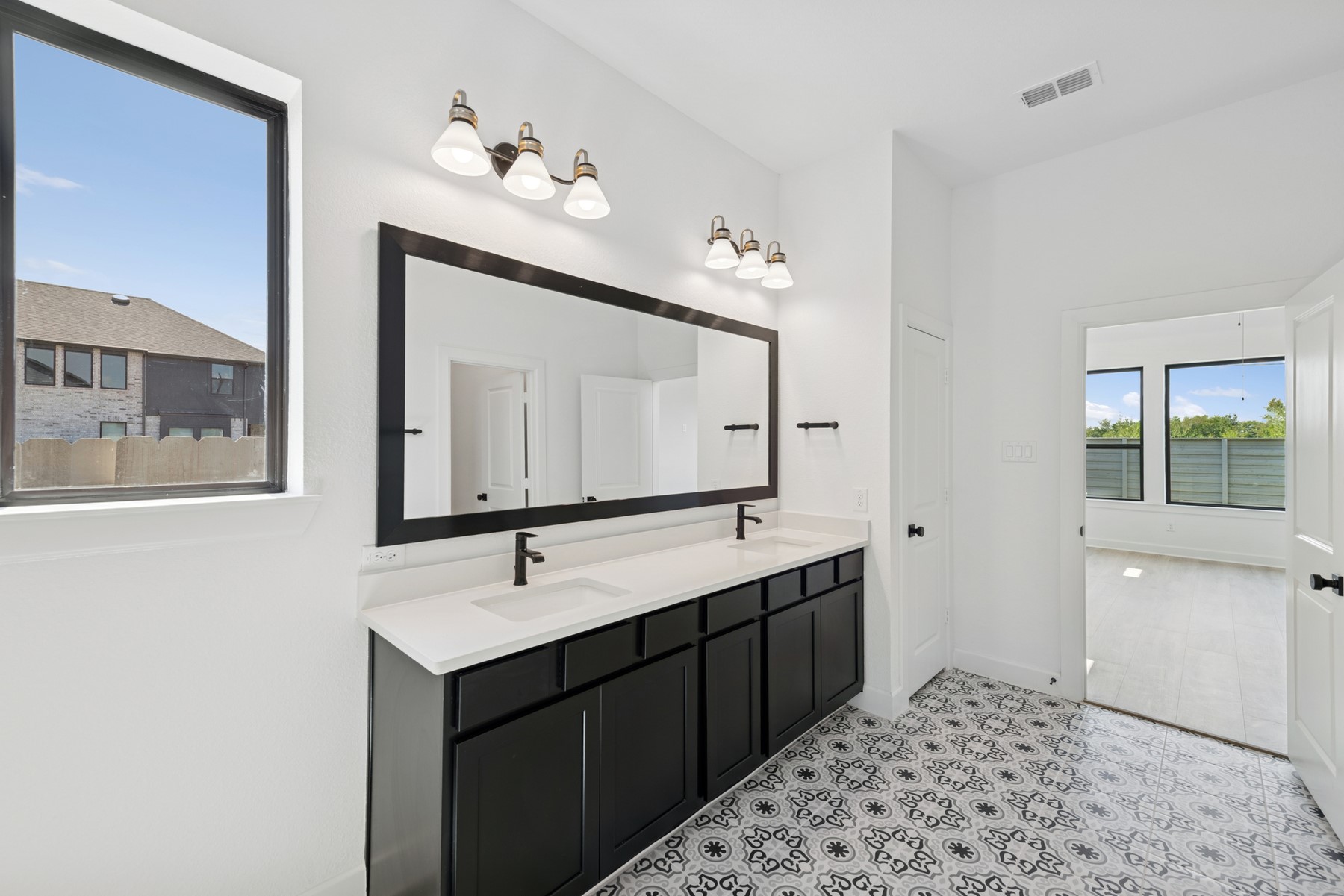 5526 Orangery Lane Manvel, TX 77578 - Photo 29 of 47 a bathroom with a sink and a mirror