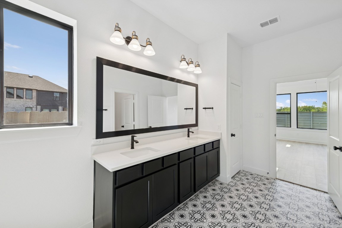 5526 Orangery Lane Manvel, TX 77578 - Photo 29 of 47 a bathroom with a sink and a mirror
