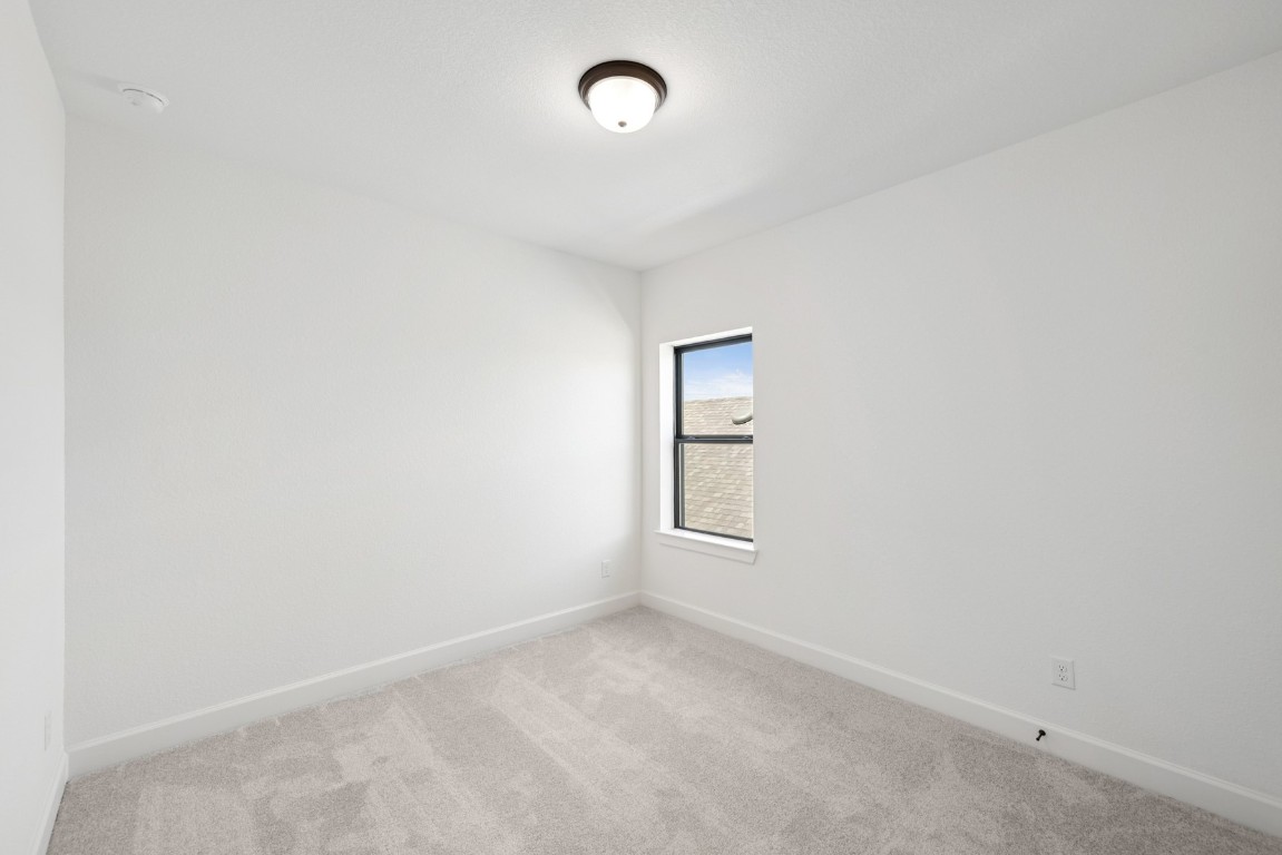 5526 Orangery Lane Manvel, TX 77578 - Photo 32 of 47 an empty room with a empty space and window
