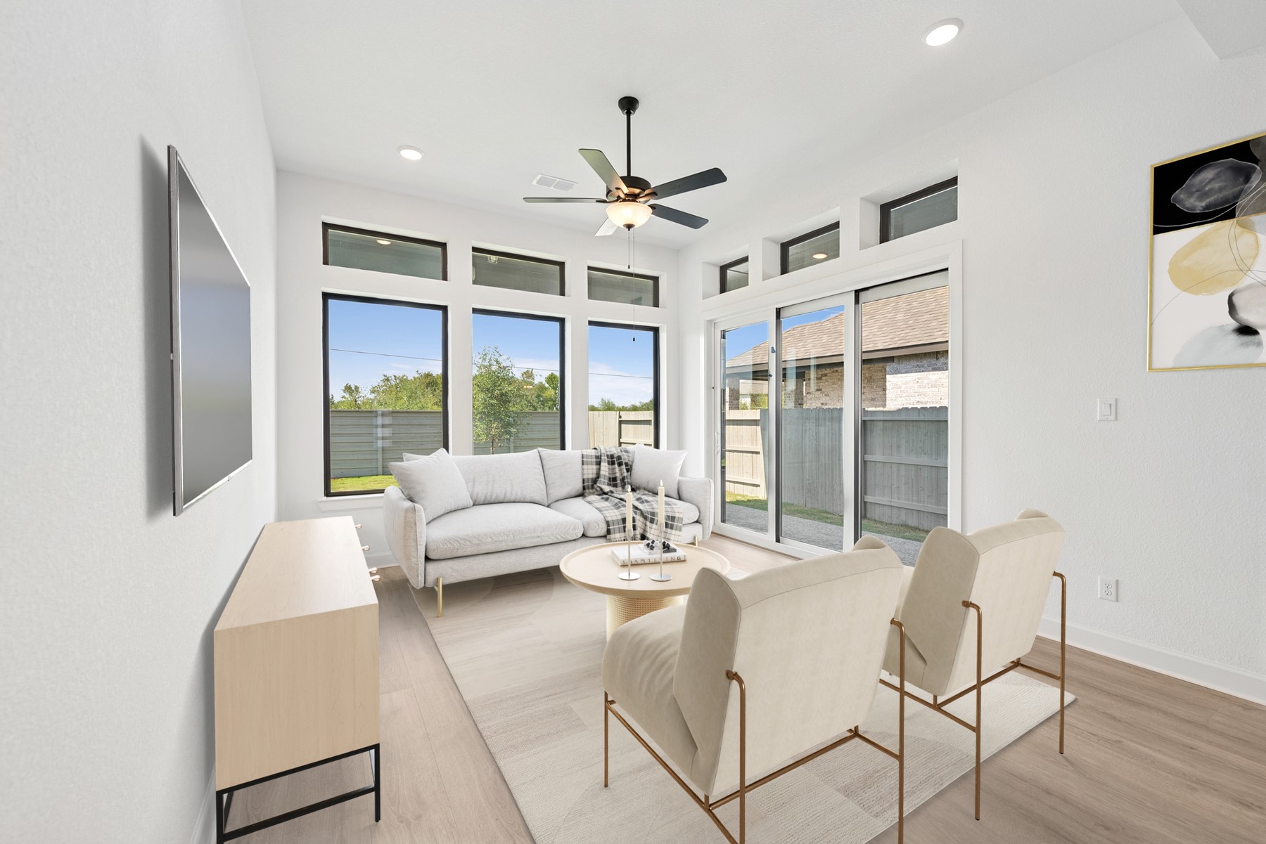 5526 Orangery Lane Manvel, TX 77578 - Photo 4 of 47 a living room with furniture ceiling fan and a large window