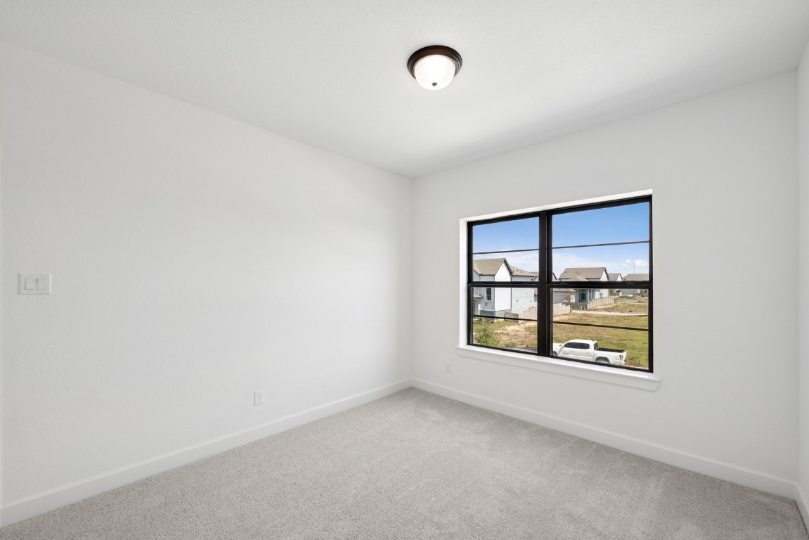 5526 Orangery Lane Manvel, TX 77578 - Photo 39 of 47 an empty room with a window